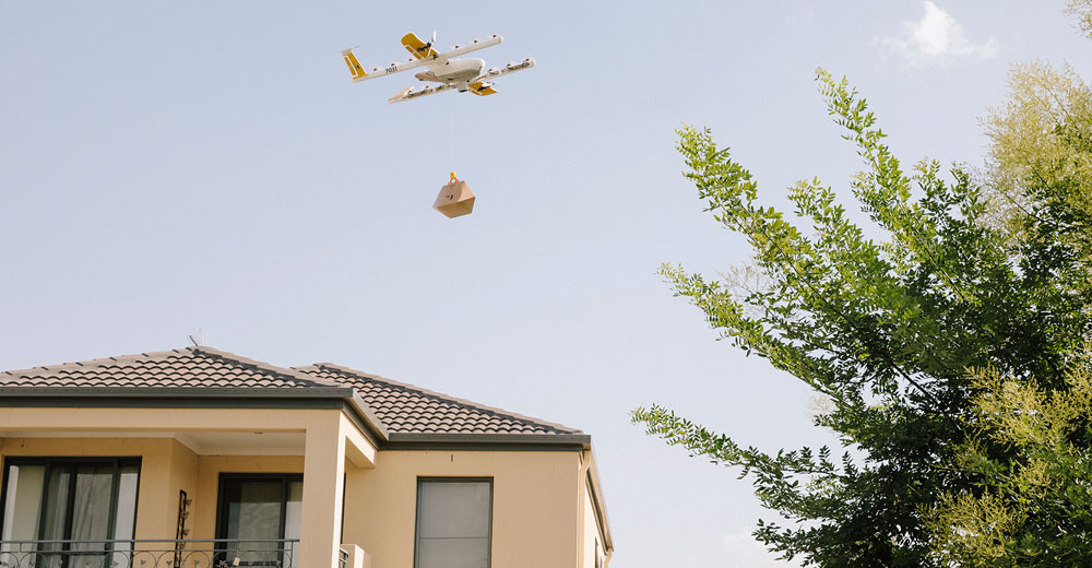 Wing drone making a delivery to a customer house