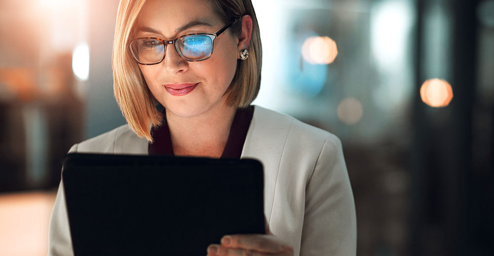 Small business owner using a digital platform powered by AI to explore personalized insurance options.