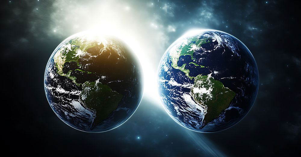 Two Earths side by side representing the real world and its digital twin in space.