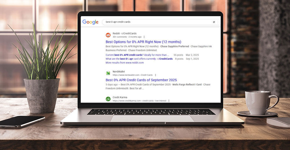 Laptop displaying Google search results for 'best 0% APR credit cards,' showing top-ranked sites like Reddit and NerdWallet.