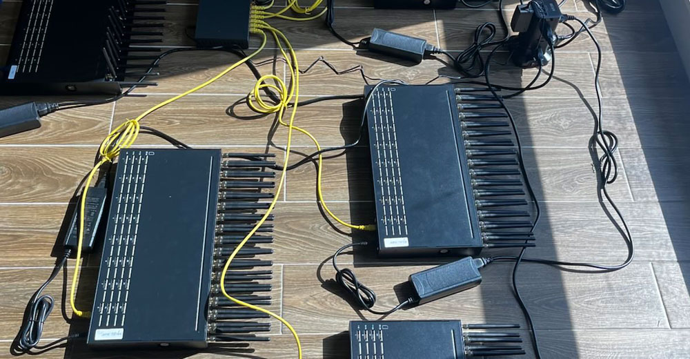 Seized SIM farm devices with multiple antennas and power cables, used in a large telecom threat network dismantled by the U.S. Secret Service in the New York City metro area.