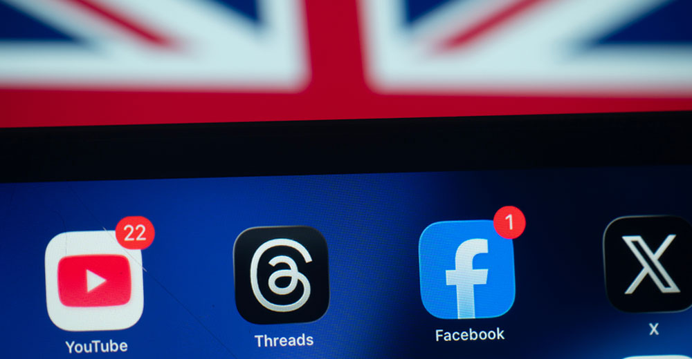 Social media apps displayed on a smartphone with the Australian flag in the background, reflecting new government restrictions on online accounts