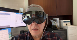 Reviewer wearing Samsung Galaxy XR headset while working at a desk