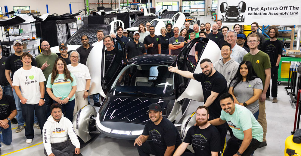 Aptera team with the company’s first solar electric vehicle on the validation assembly line in Carlsbad, Calif.